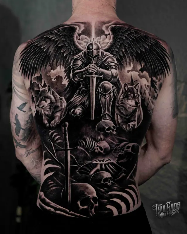Black and grey realism full back tattoo of a winged warrior with a sword