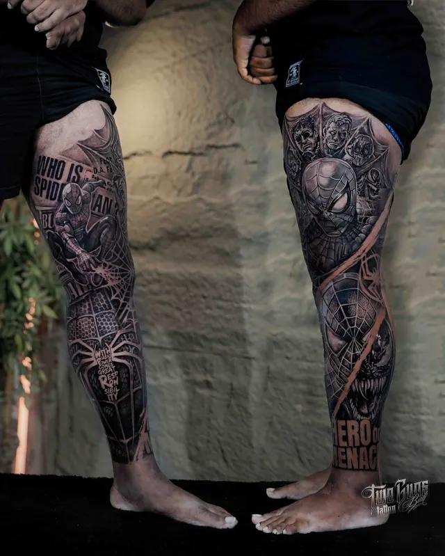 Black and grey leg sleeve tattoos with red accents on both legs