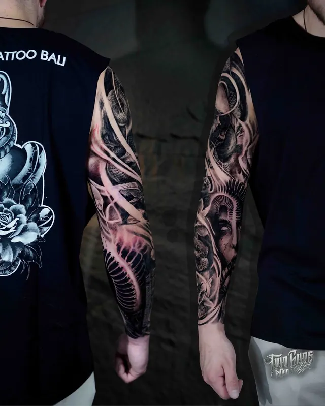 Black and grey realism full arm sleeve tattoo with red accents