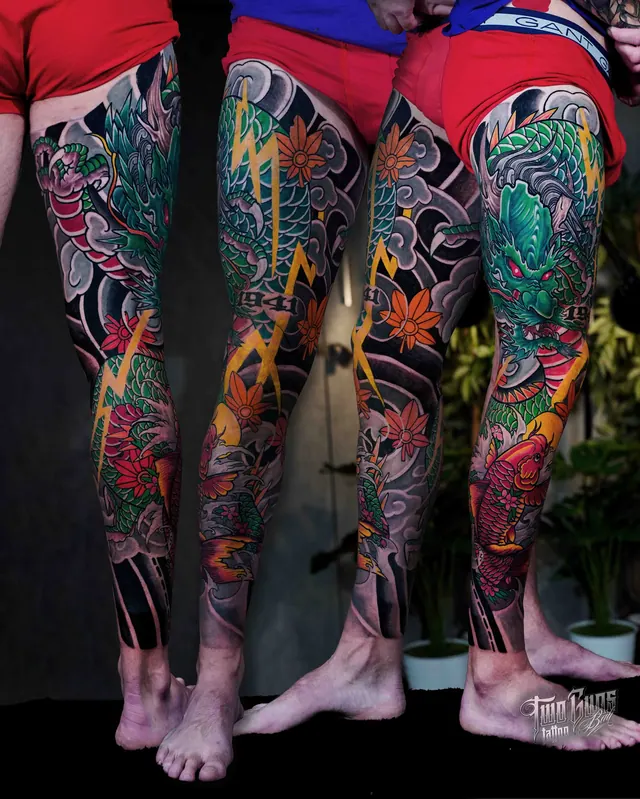 Colour Japanese leg sleeve tattoos in teal and orange, shown on two clients