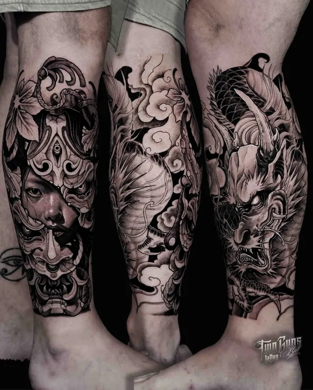 Black and grey Japanese lower leg tattoos with a hannya mask, lion dog and dragon