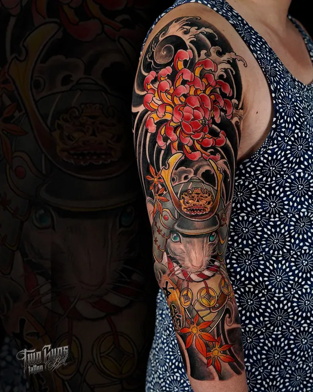 Colour Japanese full sleeve tattoo with red maple leaves and chrysanthemums on a woman