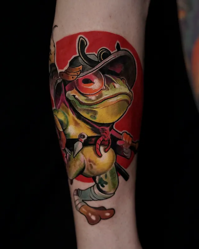 Colour surreal lower leg tattoo of a frog in a red hat and cape