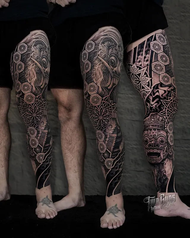 Ornamental Balinese full leg sleeve tattoos with carved mask detail