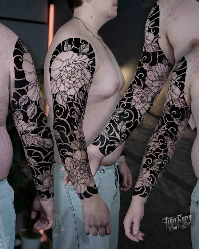 Blackwork full sleeve tattoos with negative space peonies