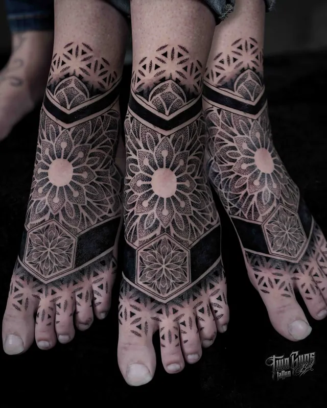 Dotwork mandala tattoos across the tops of both feet