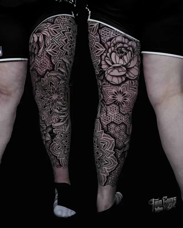 Dotwork ornamental leg tattoos with flowers on both legs