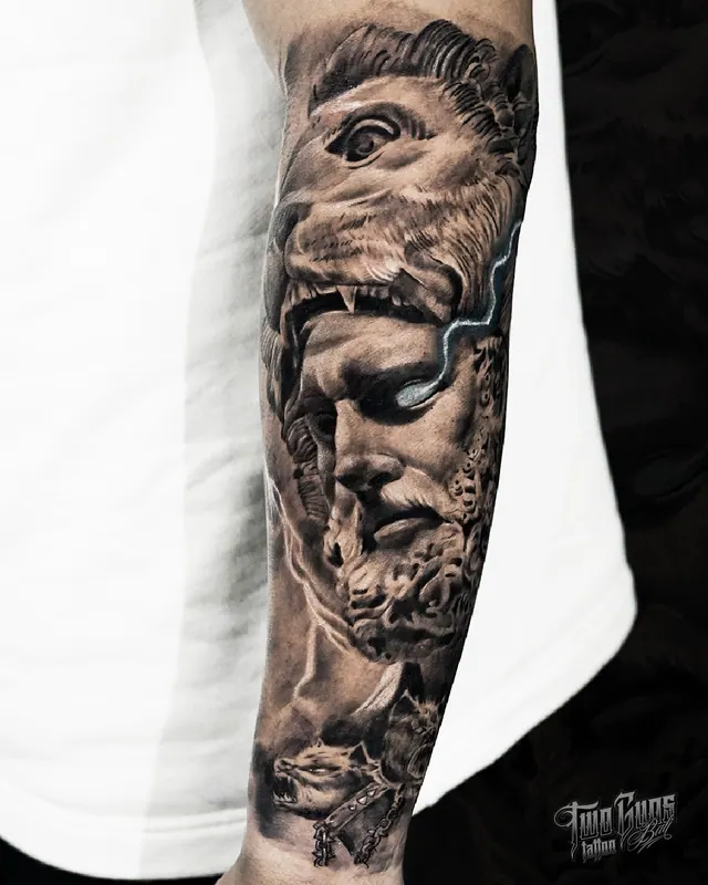 Black and grey realism forearm sleeve tattoo of a Greek statue head with ornamental work