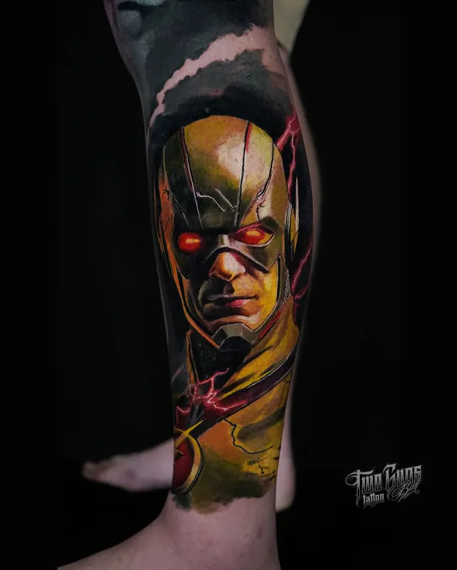 Colour realism leg tattoo of a masked superhero in gold and red