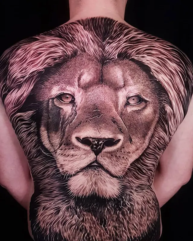 Black and grey realism full back tattoo of a lion's head