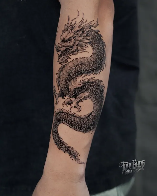 Fine line Japanese dragon tattoo on the forearm