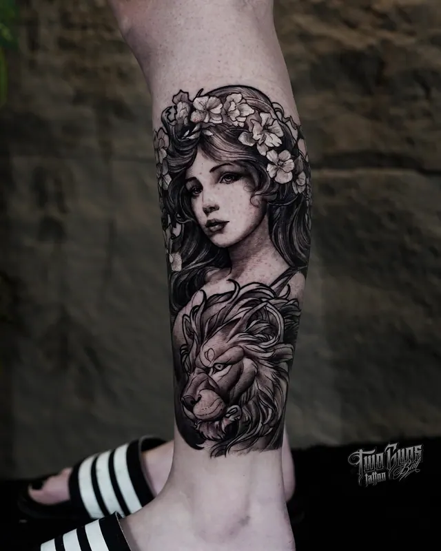 Black and grey art nouveau portrait of a woman with flowers in her hair, on the lower leg