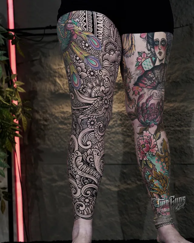 Ornamental blackwork and colour leg sleeve tattoos shown side by side on two women