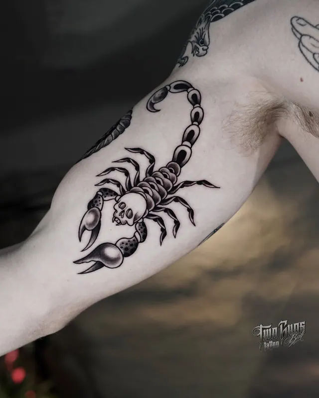 Blackwork scorpion tattoo on the inner arm