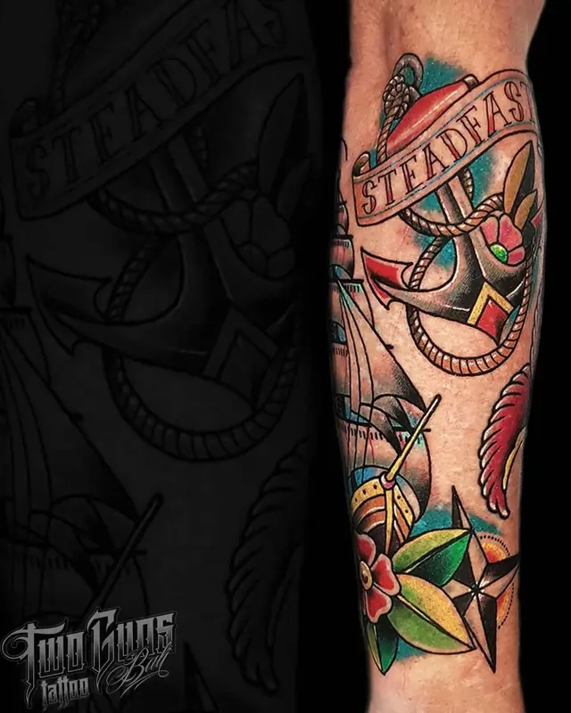 Colour traditional forearm tattoo of an anchor with a Steadfast banner and flowers