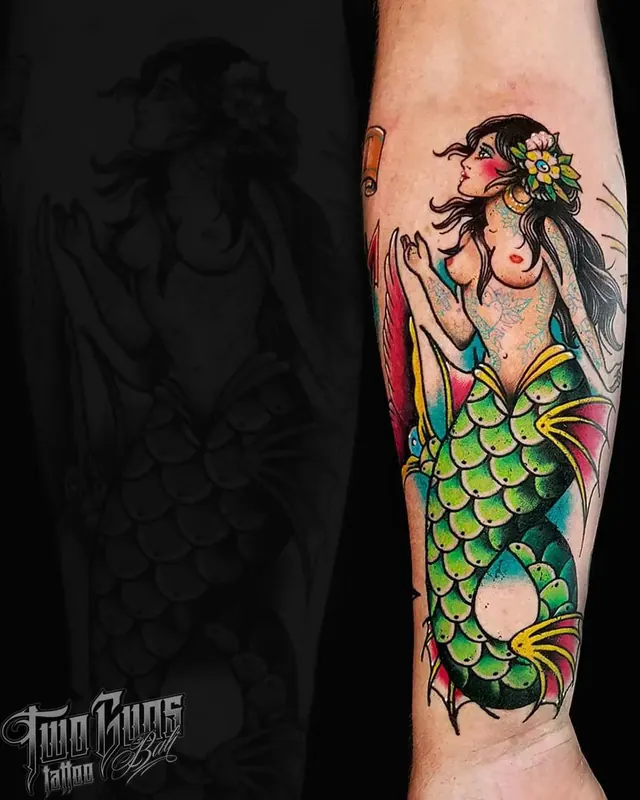 Colour traditional forearm tattoo of a mermaid