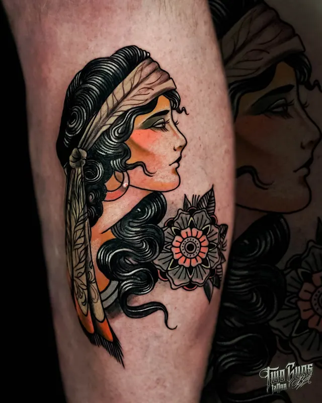 Colour traditional calf tattoo of a woman's head in a feather headdress