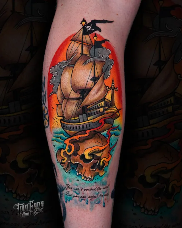 Colour neo-traditional calf tattoo of a pirate ship above a flaming skull